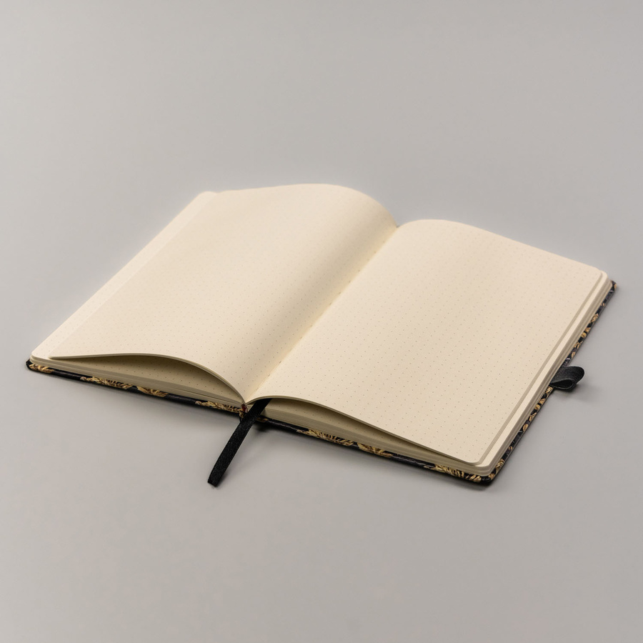 Czarno-złoty notes zadrukowany w kropki i wyposażony w gumkę zamykającą - Peterson