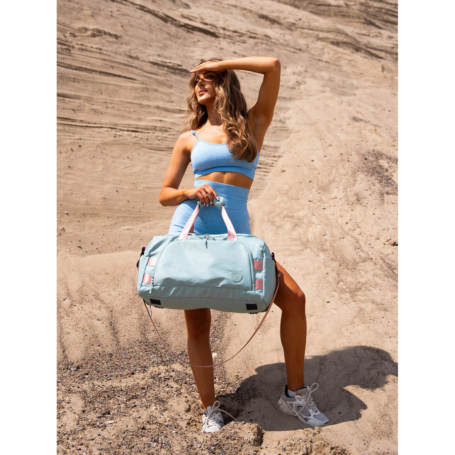 Zielono-różowa torba weekendowo-podróżna z uchwytem na walizkę i kieszenią zewnętrzną - Peterson