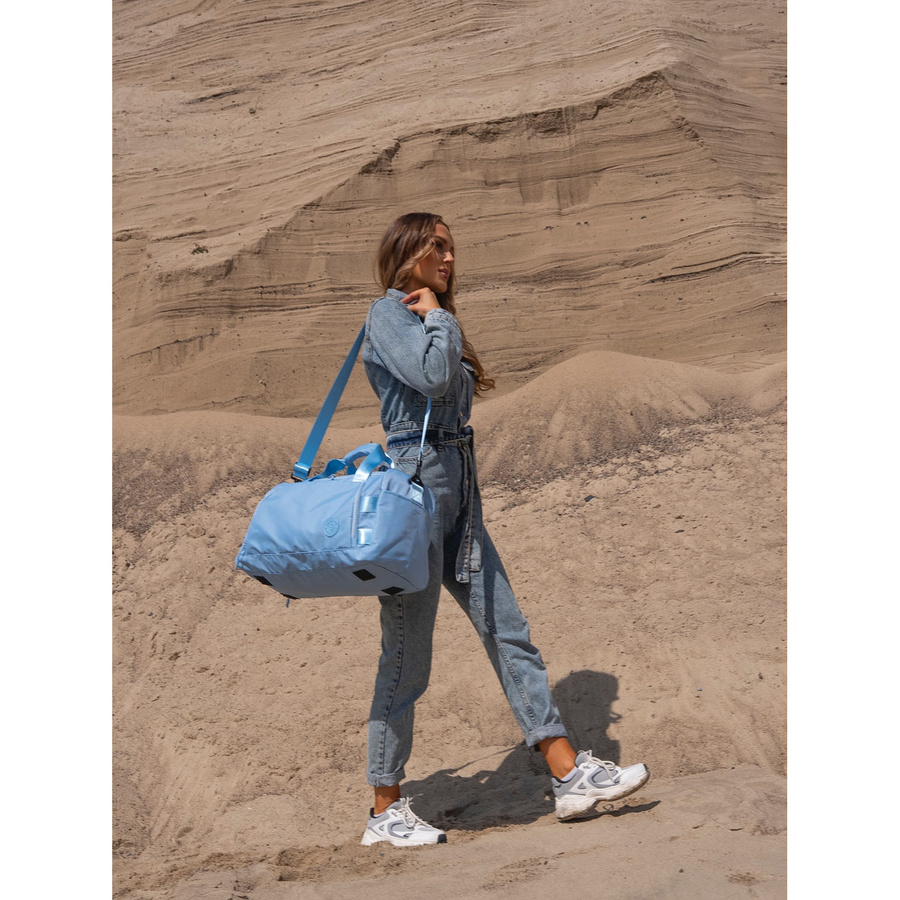 Weekendowa torba podróżna w błękitnym kolorze z uchwytem na walizkę - Peterson