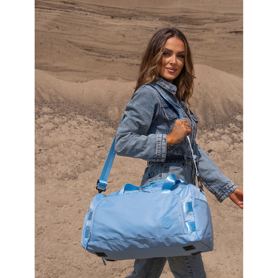 Weekendowa torba podróżna w błękitnym kolorze z uchwytem na walizkę - Peterson