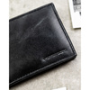 Czarny portfel męski ze skóry naturalnej bez zapięcia zewnętrznego - Peterson