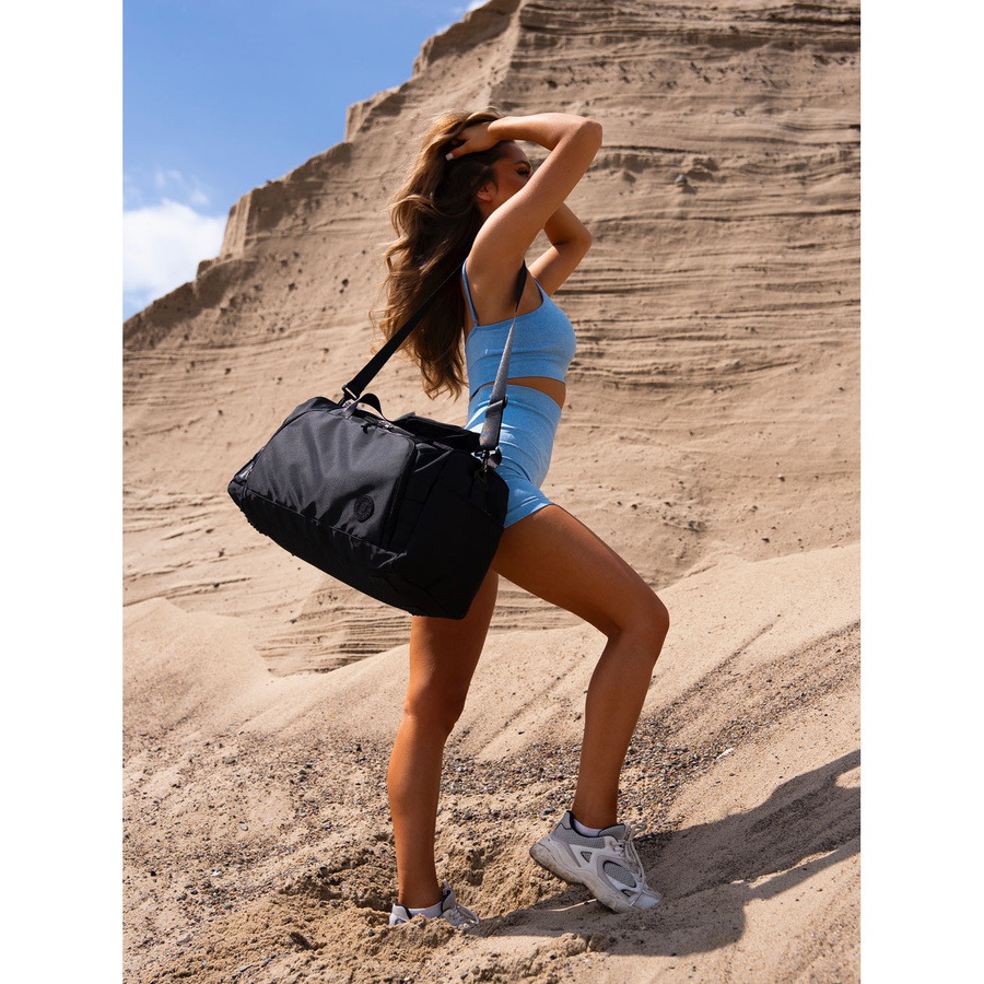 Czarna torba podróżna z uchwytem na walizkę - Peterson