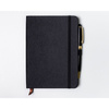 Czarny notes w formacie B6 zadrukowany w kropki, wyposażony w gumkę zamykającą - Peterson